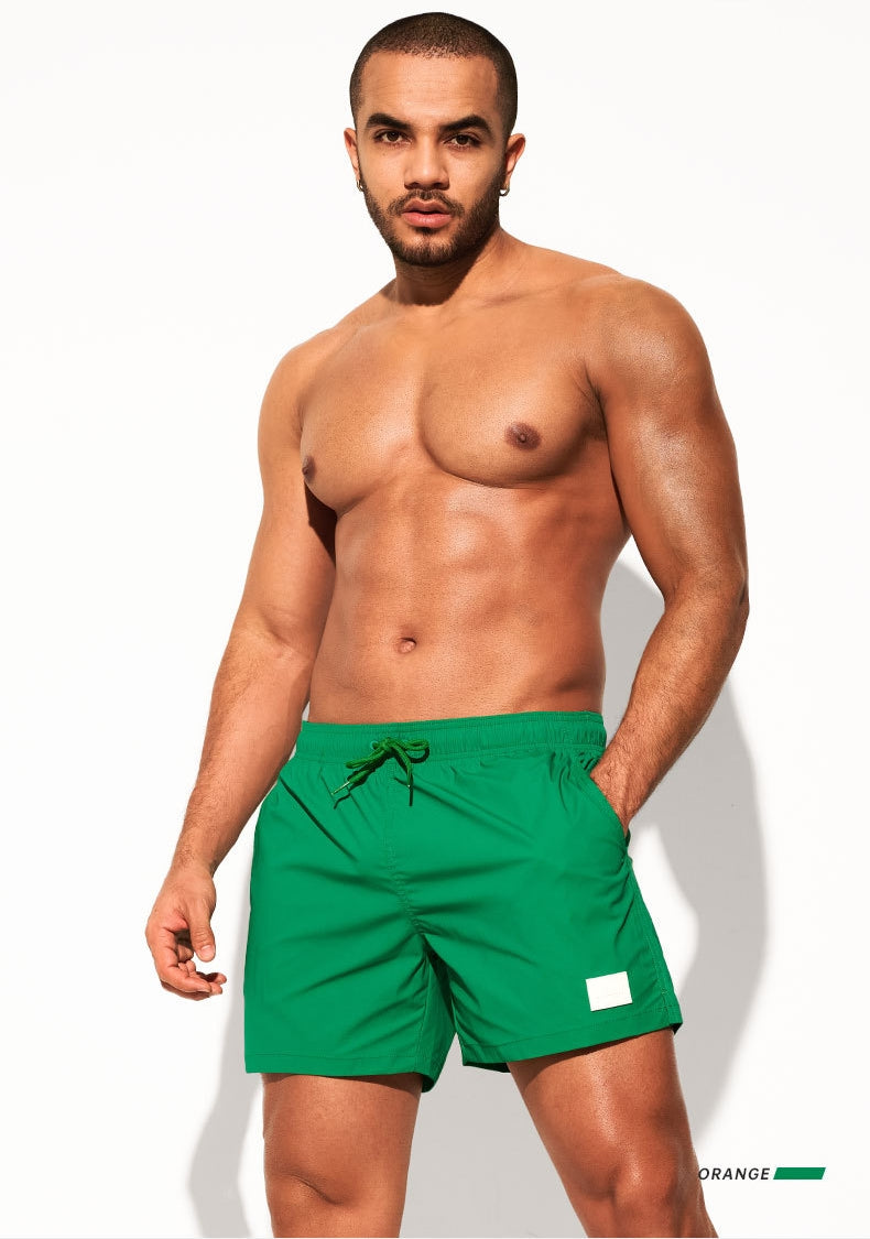Front view of DESMIIT Quick-Dry Swim Beach Shorts with Quick Dry feature in Green.