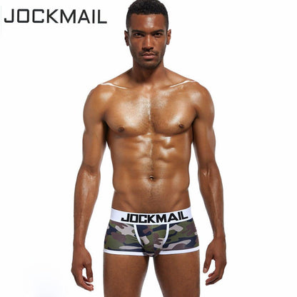 Daily wear|Gym sessions|Holiday parties|Pride events|Night gatherings|Breathable|Butt-lift design|Snug fit|Lightweight|Shaping|Waistline control|Slimming|Abdomen control|Comfort|Proper support|Stylish appearance|Festive mood|Body sculpting|Men's trunks|Low-rise underwear|Camo trunks|Sexy trunks|Green|Front view