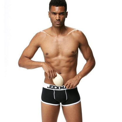 Daily wear|Gym sessions|Holiday parties|Pride events|Night gatherings|Breathable|Butt-lift design|Snug fit|Lightweight|Shaping|Waistline control|Slimming|Abdomen control|Comfort|Proper support|Stylish appearance|Festive mood|Body sculpting|Men's trunks|Low-rise underwear|Cotton trunks|Sponge pad trunks|Sexy trunks|Black|Front view