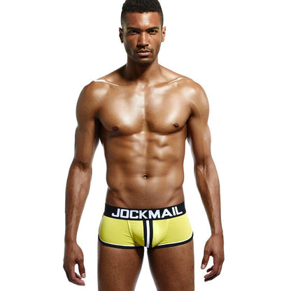Daily wear|Gym sessions|Holiday parties|Pride events|Night gatherings|Breathable|Butt-lift design|Snug fit|Lightweight|Shaping|Waistline control|Slimming|Abdomen control|Comfort|Proper support|Stylish appearance|Festive mood|Body sculpting|Men's trunks|Low-rise underwear|Polyester pouch trunks|Sexy trunks|Open-back trunks|Yellow|Front view